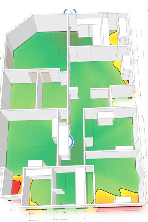 After, seen at an angle: green coverage through the living areas and bedrooms with both access points in place.