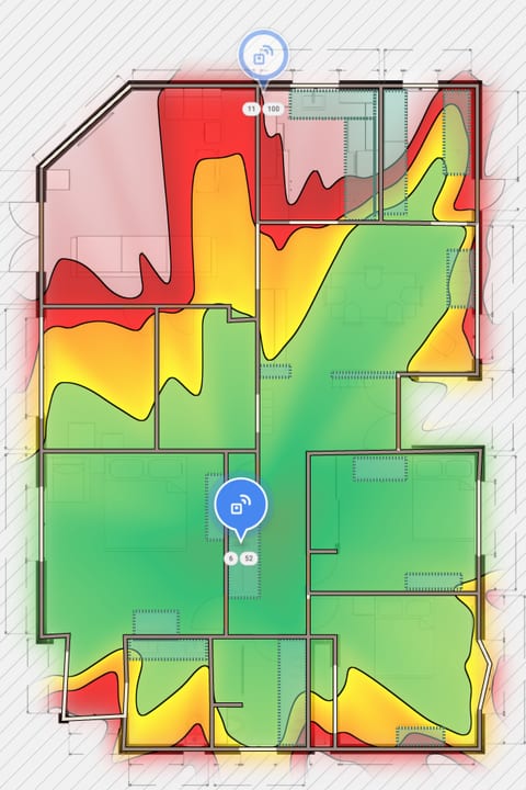 Planning view with two access points placed: coverage from the access point in the central hall, green across the bedrooms.